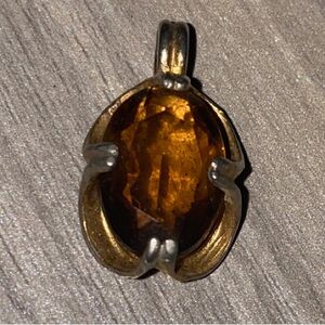 Elegant Gold Pendant with Amber Stone
